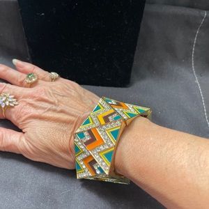 Bright fashion bracelet. It has multiple colors & crystals Shiny & stretches